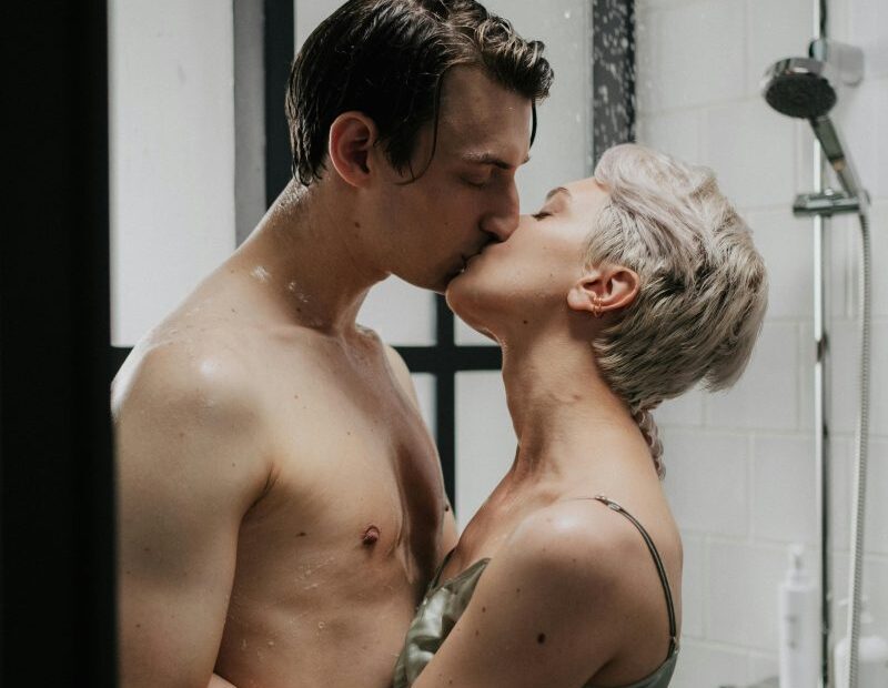Couple kissing passionately together in the shower